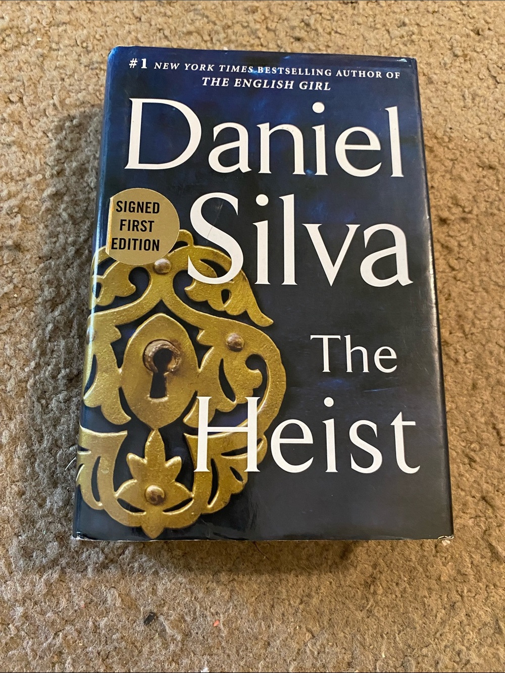 The Heist by Daniel Silva Signed First Edition Hardcover - Navy and Gold